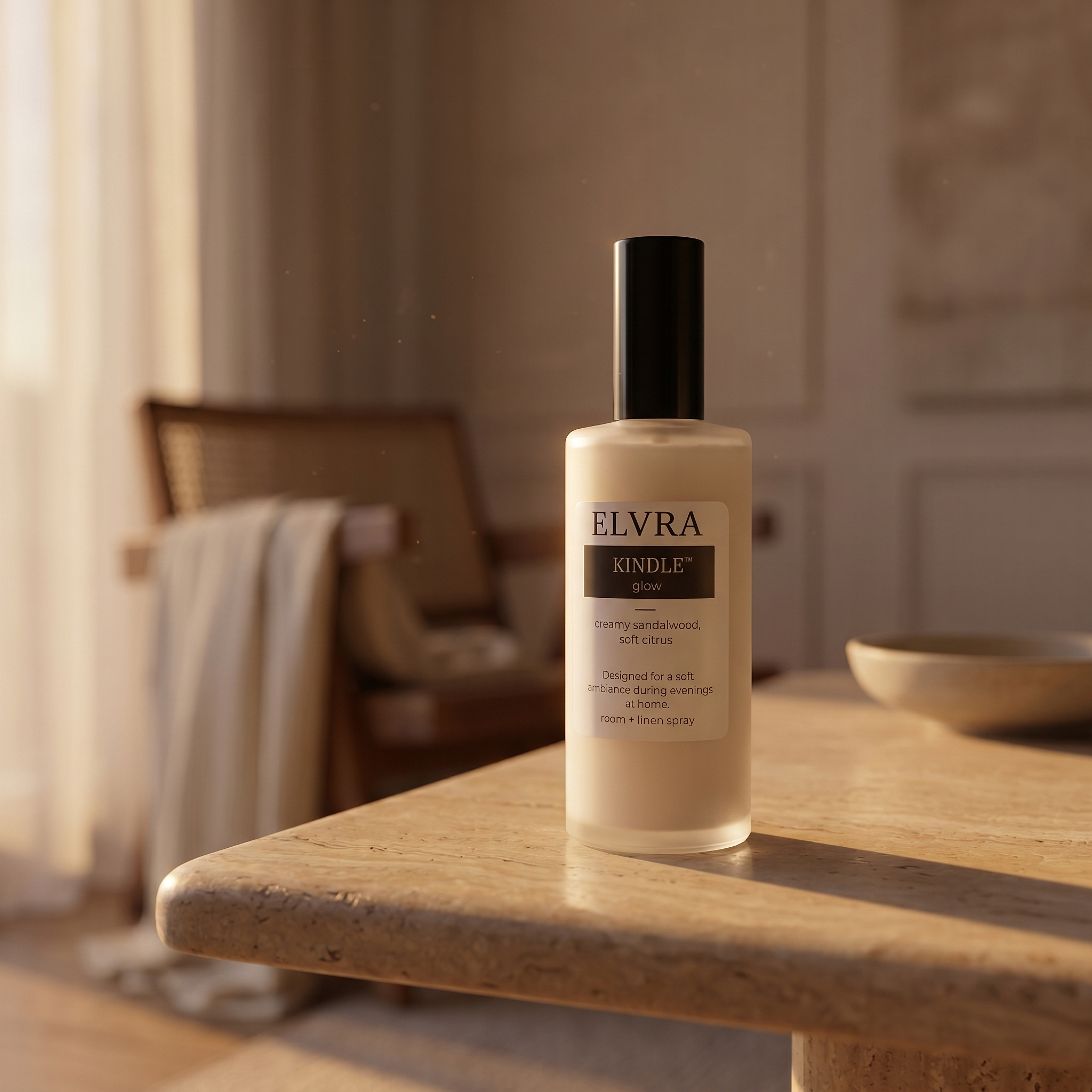 Elvra KINDLE Glow Atmosphere mist bottle on warm travertine with soft sunset light, blurred linen curtains, and quiet room details.