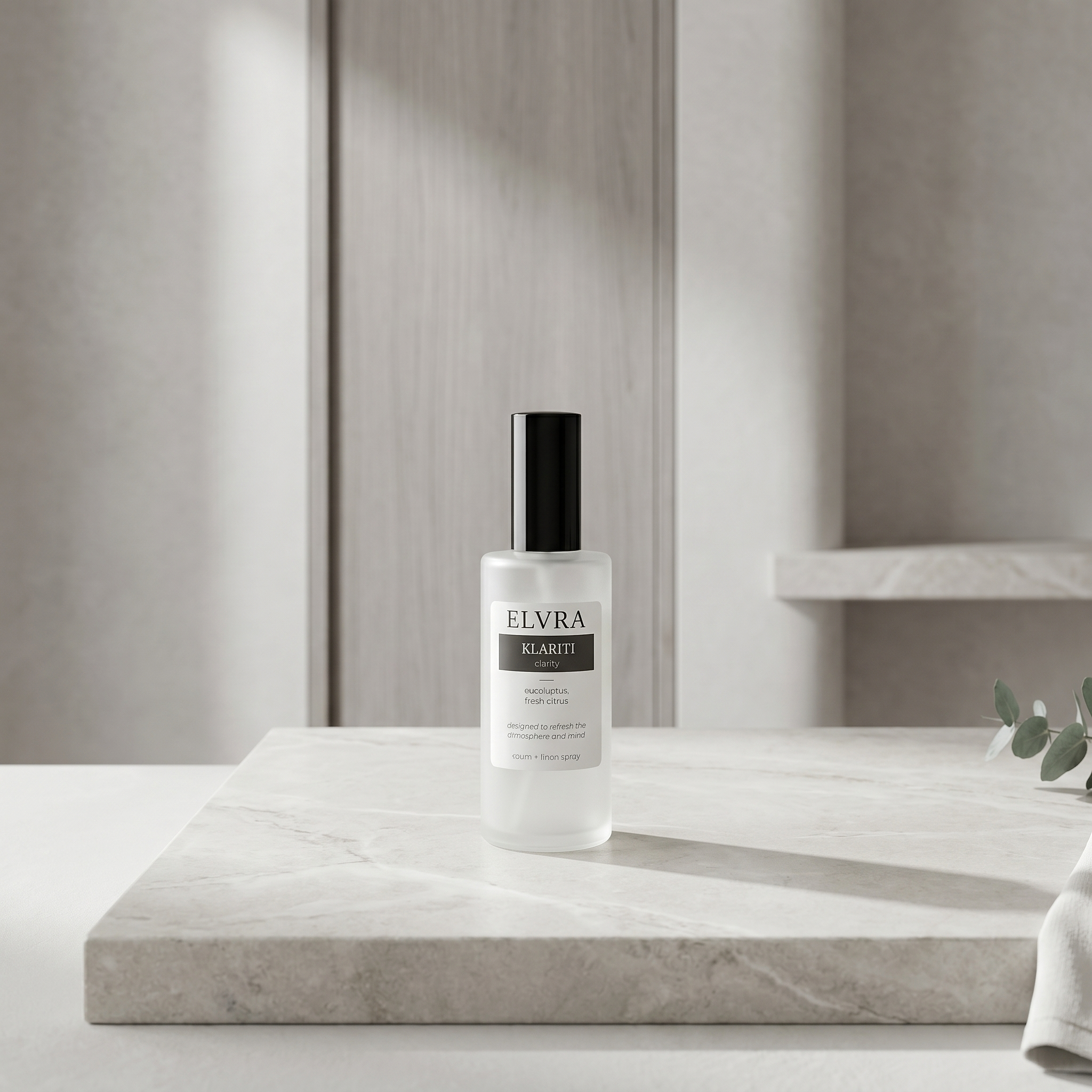 ELVRA KLARITI atmosphere and linen spray on honed stone in a pale, serene interior with soft directional light.
