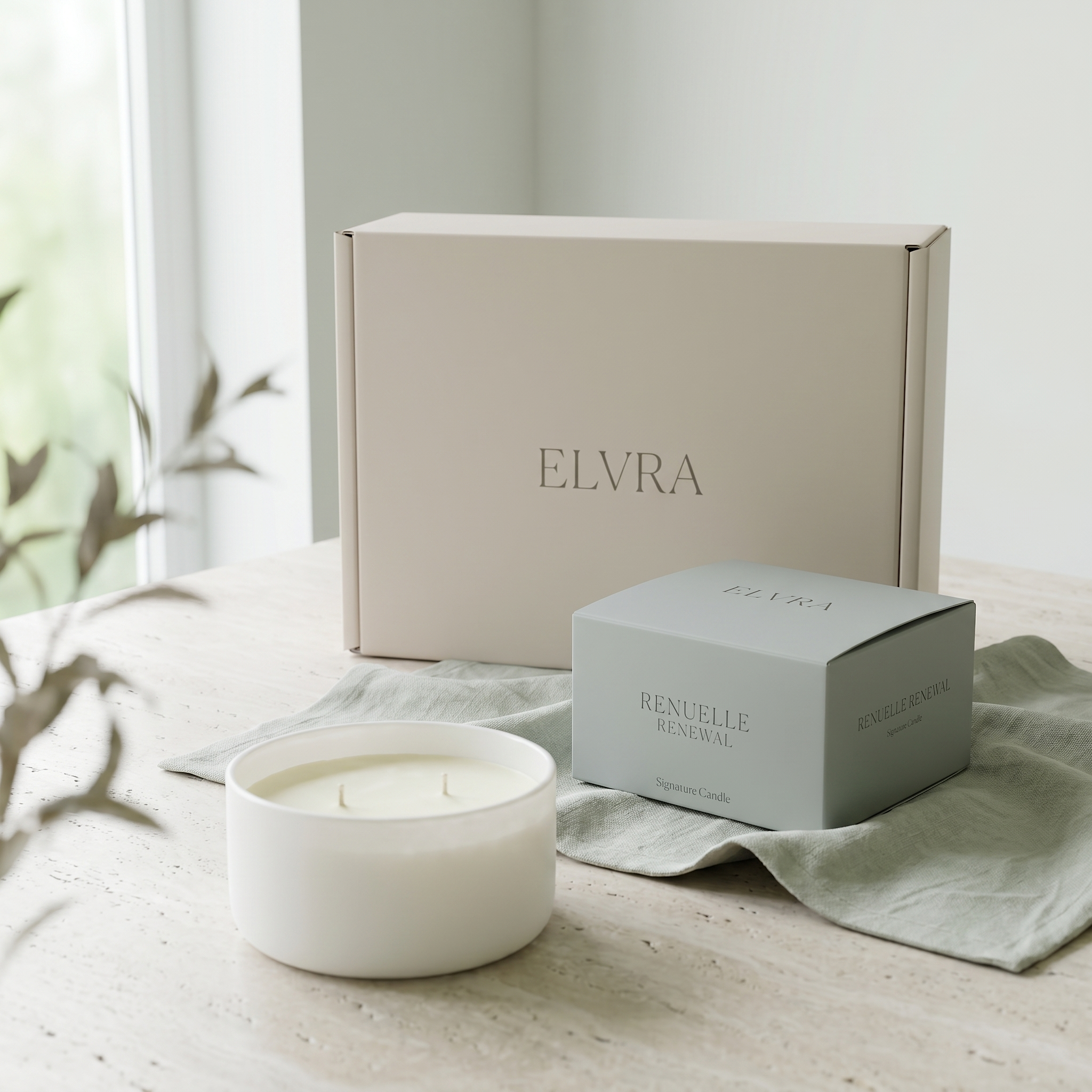 Luxury candle duo with boxes and open candle on pale stone, lit by soft daylight and linen accents.